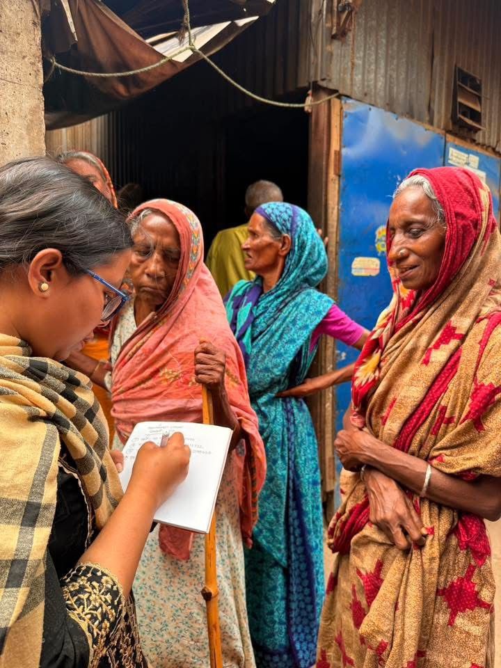 Volunteer conducting community health assessment survey